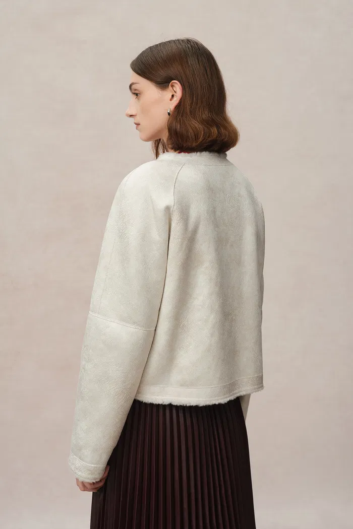 10912-arran-hand-braided-leather-button-short-coat-in-faux-sheepskin-1.webp