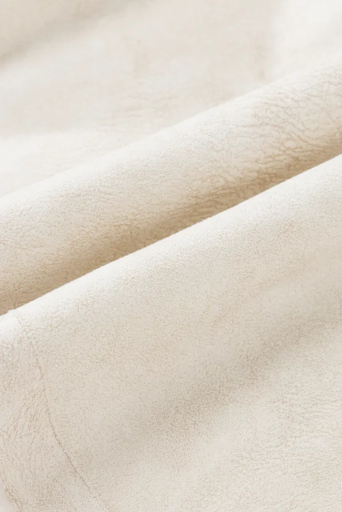 10912-arran-hand-braided-leather-button-short-coat-in-faux-sheepskin-1.webp