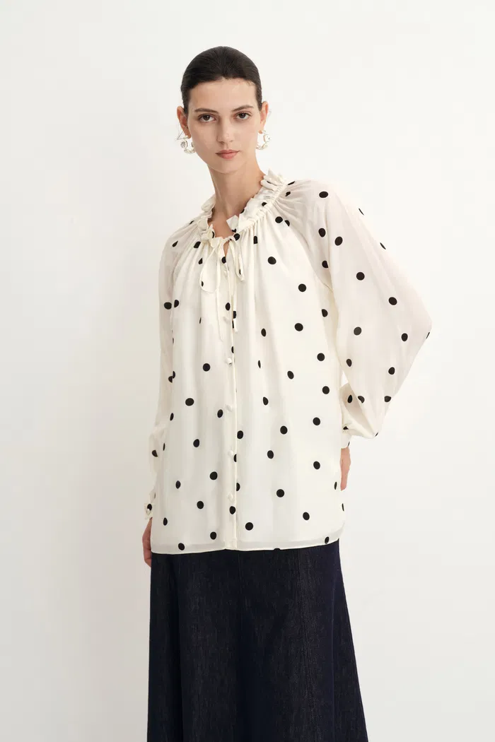 1951-kari-ruffle-neckline-polka-dot-blouse-in-silk-satin-1.webp