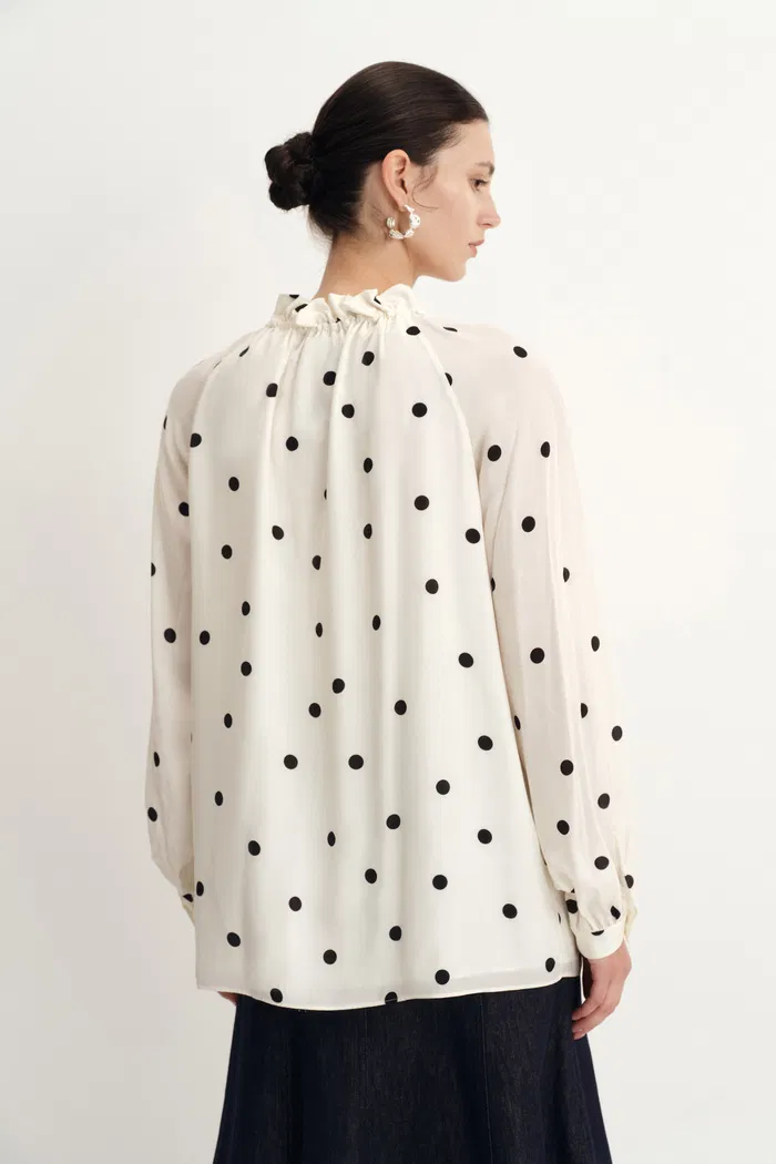 1951-kari-ruffle-neckline-polka-dot-blouse-in-silk-satin-1.webp
