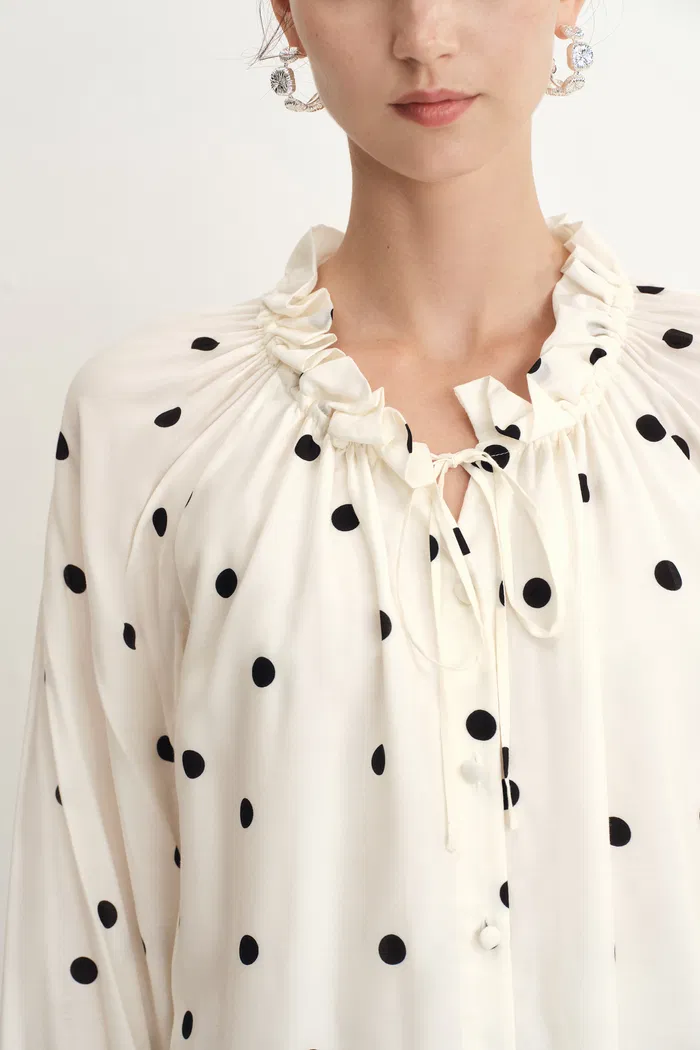 1951-kari-ruffle-neckline-polka-dot-blouse-in-silk-satin-1.webp