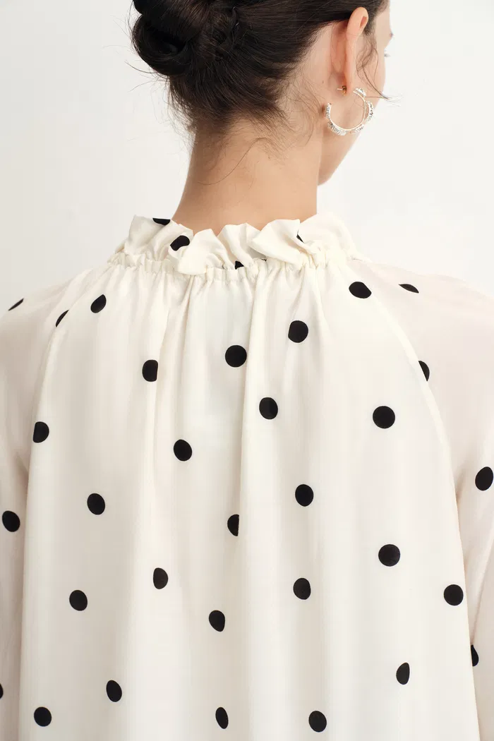 1951-kari-ruffle-neckline-polka-dot-blouse-in-silk-satin-1.webp