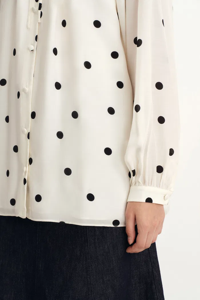 1951-kari-ruffle-neckline-polka-dot-blouse-in-silk-satin-1.webp