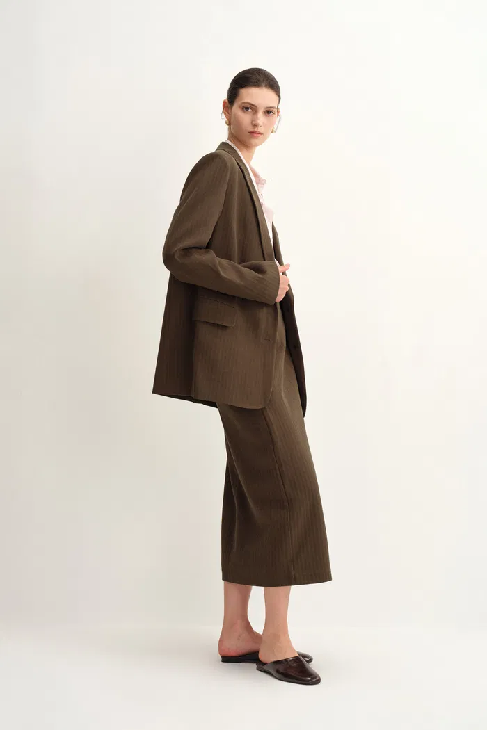 2558-jeanet-adjustable-tie-asymmetric-midi-skirt-in-cotton-herringbone-1.webp