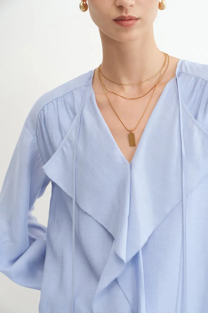 3549-karina-ruffle-v-neck-blouse-in-acetate-modal-blend-1.webp