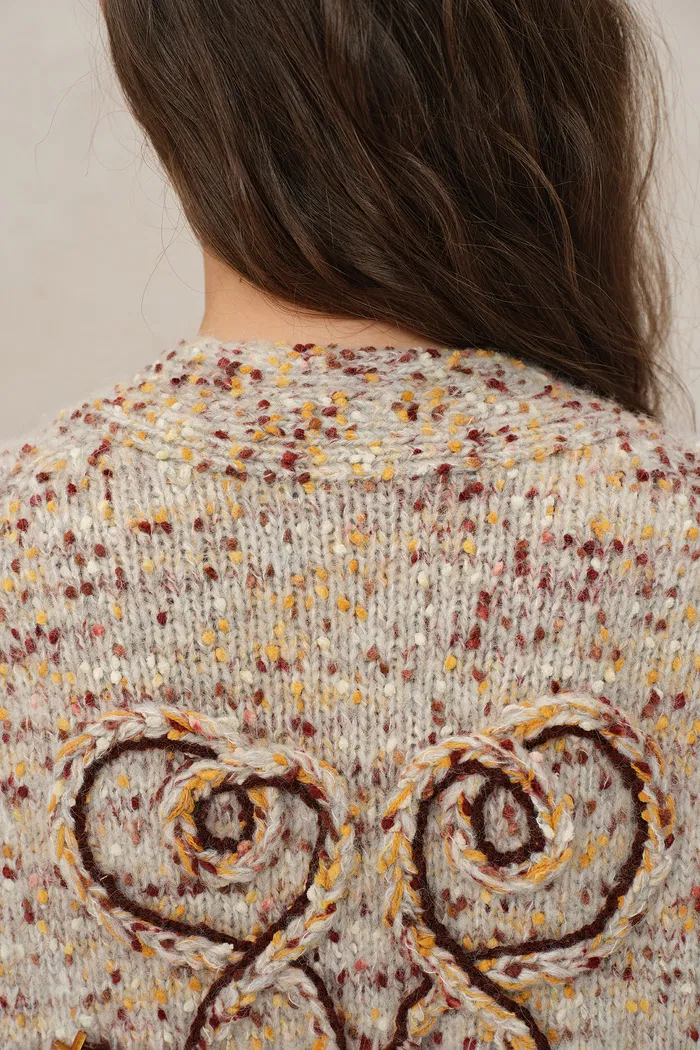 4440-nika-zodiac-jacquard-knit-cardigan-in-wool-mohair-pom-pom-knit-1.webp